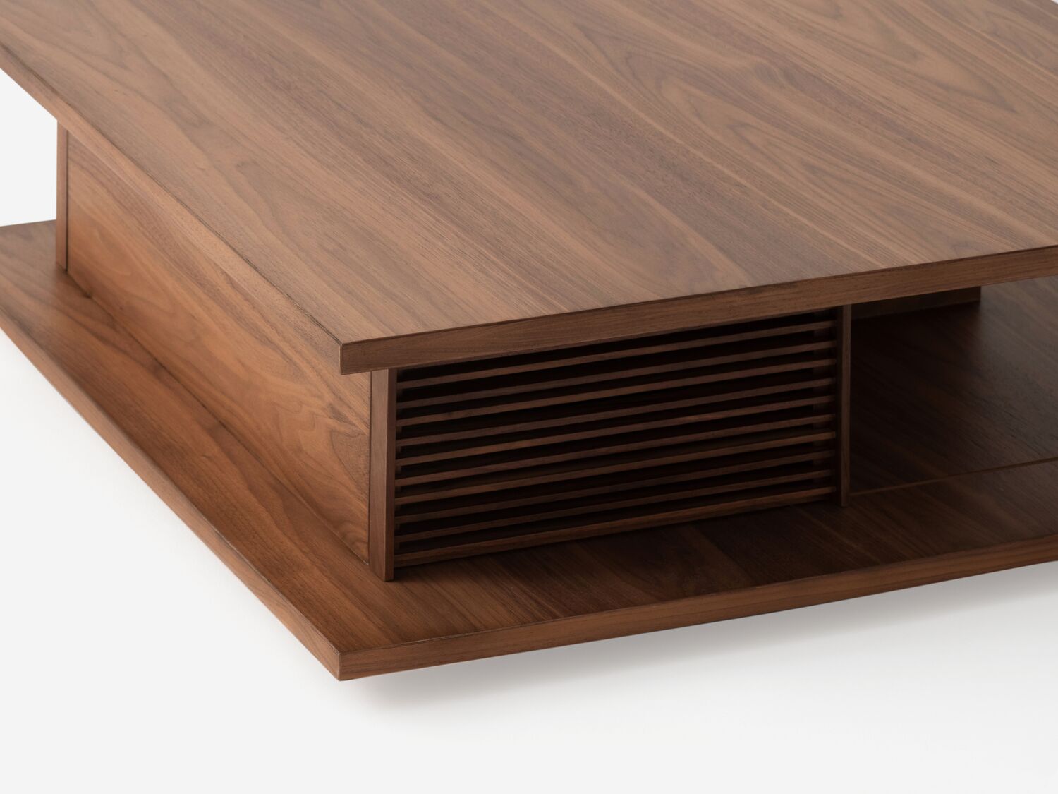 Detail view of the Plank modern square coffee table in walnut with slats